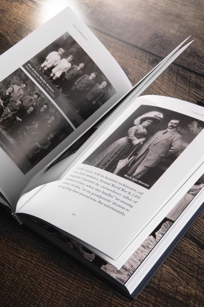 Family photographs laid into an open Biograph spread