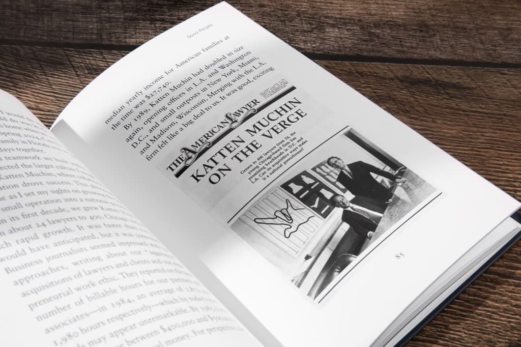 Press clipping spread inside a signature-bound book